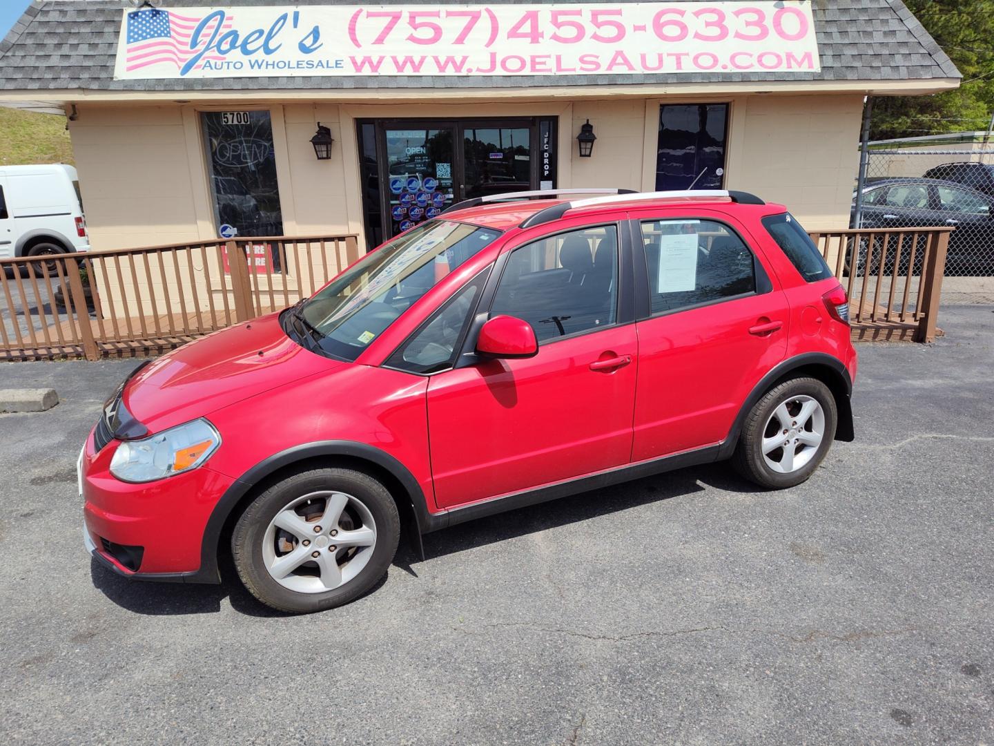 2007 Red /Black Suzuki SX4 (JS2YB417X75) , Automatic transmission, located at 5700 Curlew Drive, Norfolk, VA, 23502, (757) 455-6330, 36.841885, -76.209412 - Photo#0